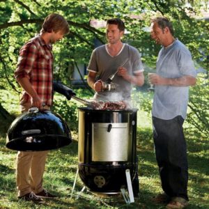 3 men discussing around a Weber Smokey Mountain Cooker