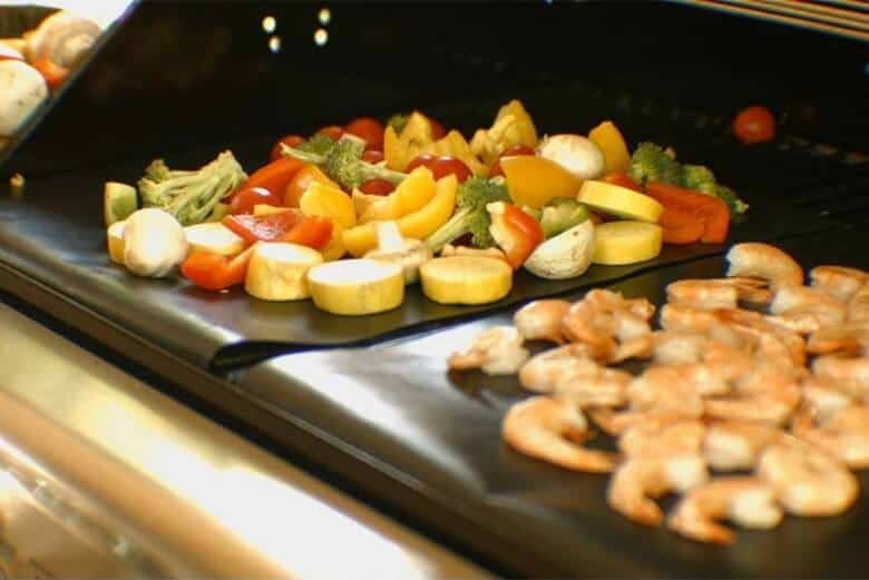 Shrimps and vegetables being grilled on a Renook grill mat